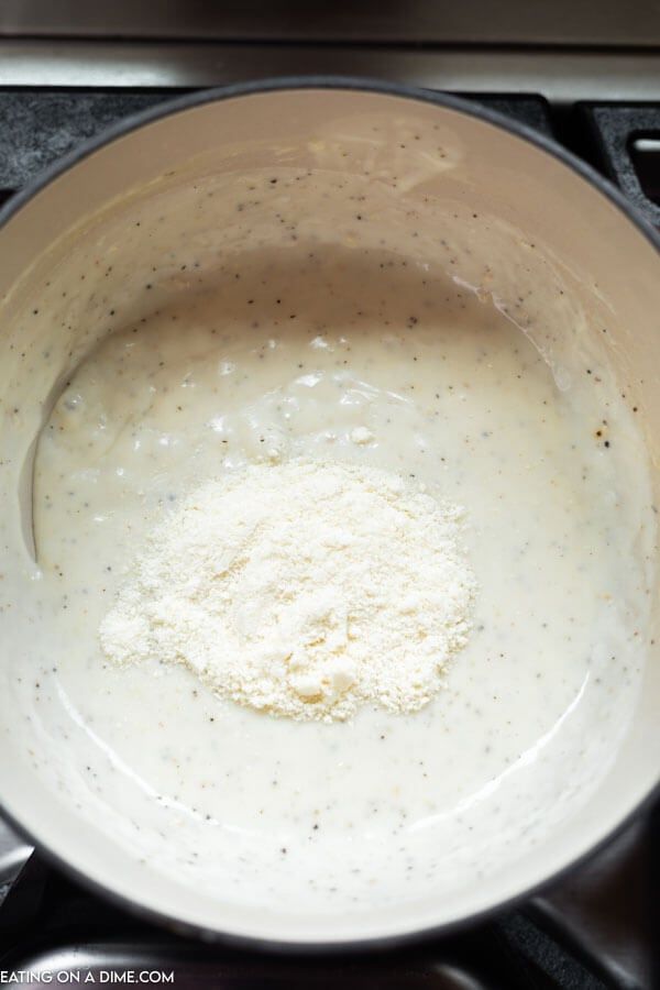 a pan filled with food sitting on top of a stove