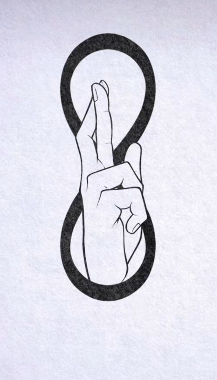 a hand making the peace sign with it's fingers in front of a white paper background