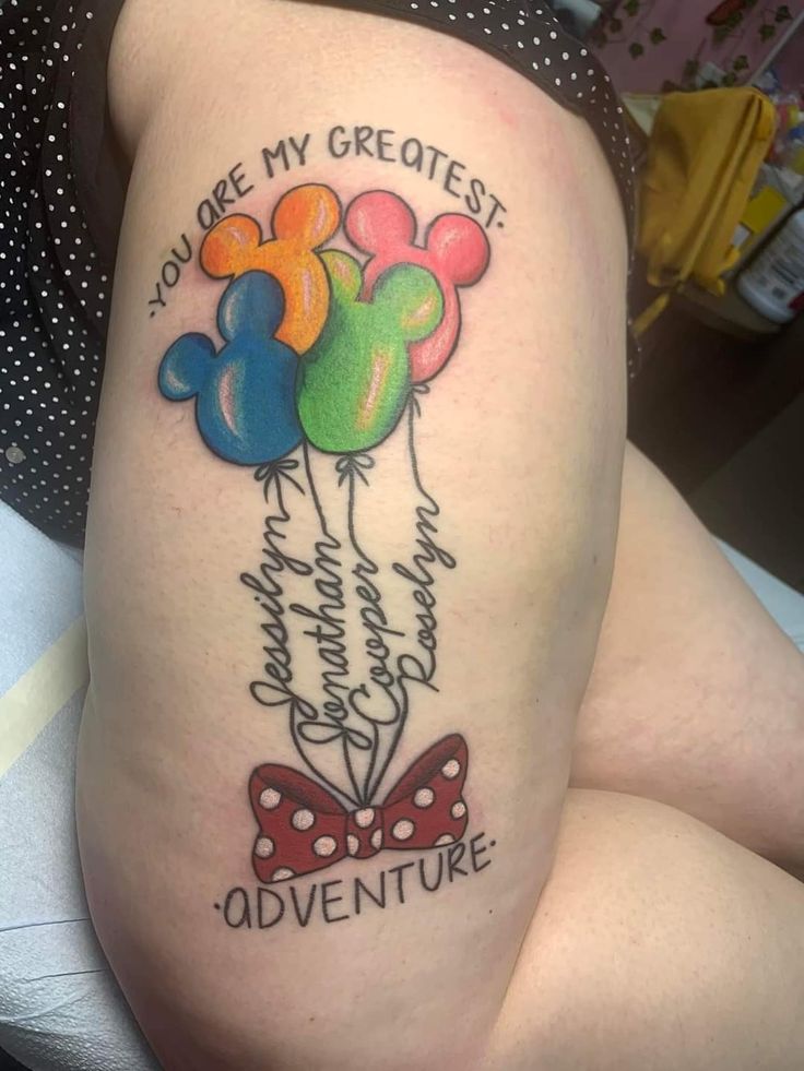 a woman with a tattoo on her thigh that says, you are my greatest adventure