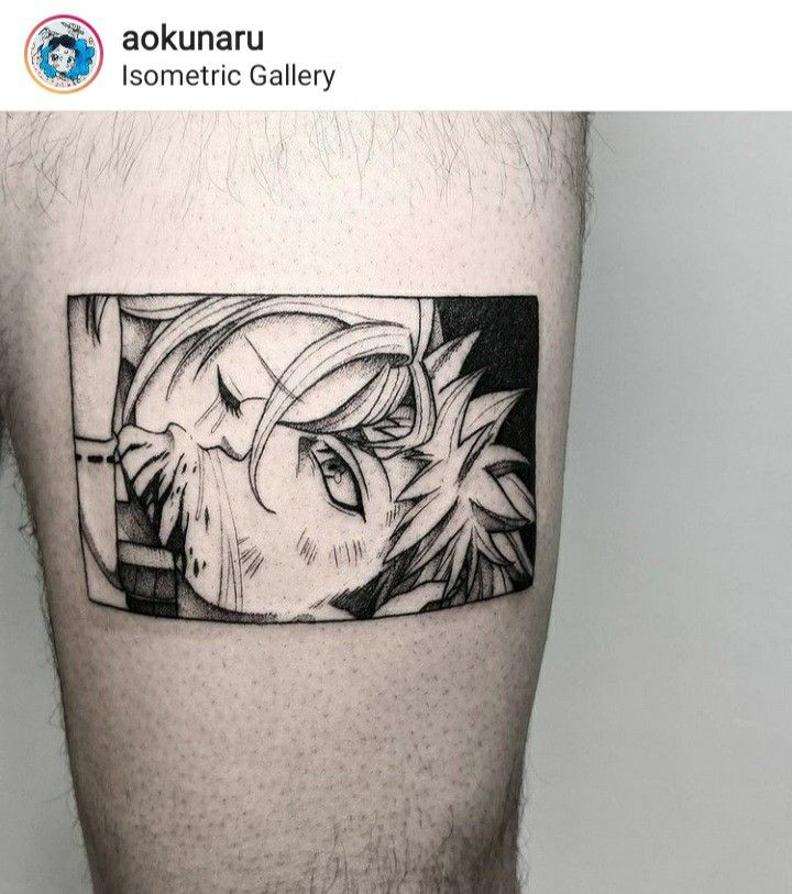 a man's leg with a black and white tattoo design on the side of his thigh