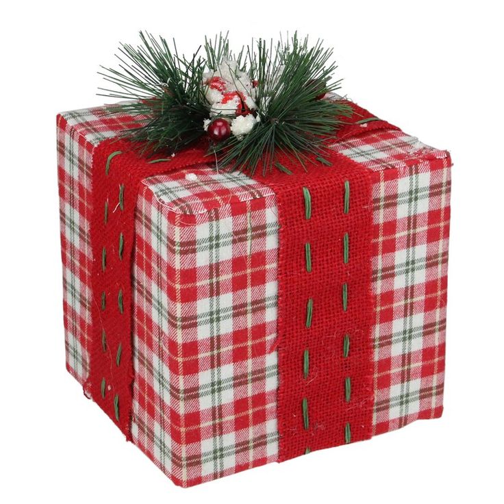 a christmas present wrapped in red and white checkered paper with a pine branch on top