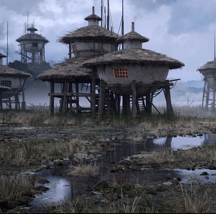 an old village with thatched roofs and mud huts on stilts in the foreground