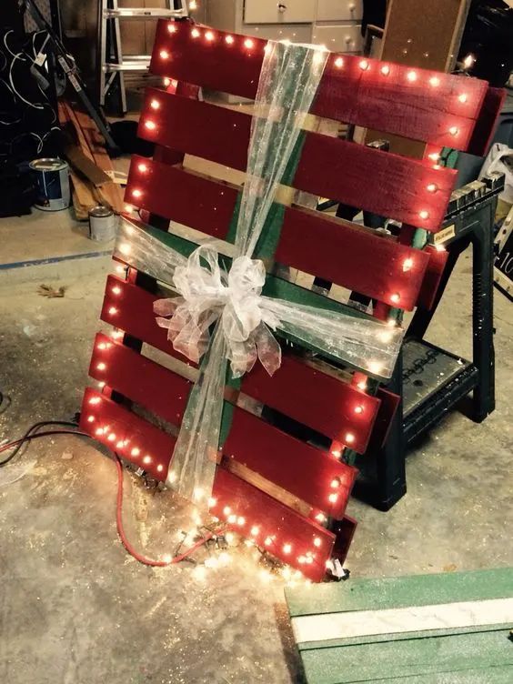 a wooden crate with lights wrapped around it