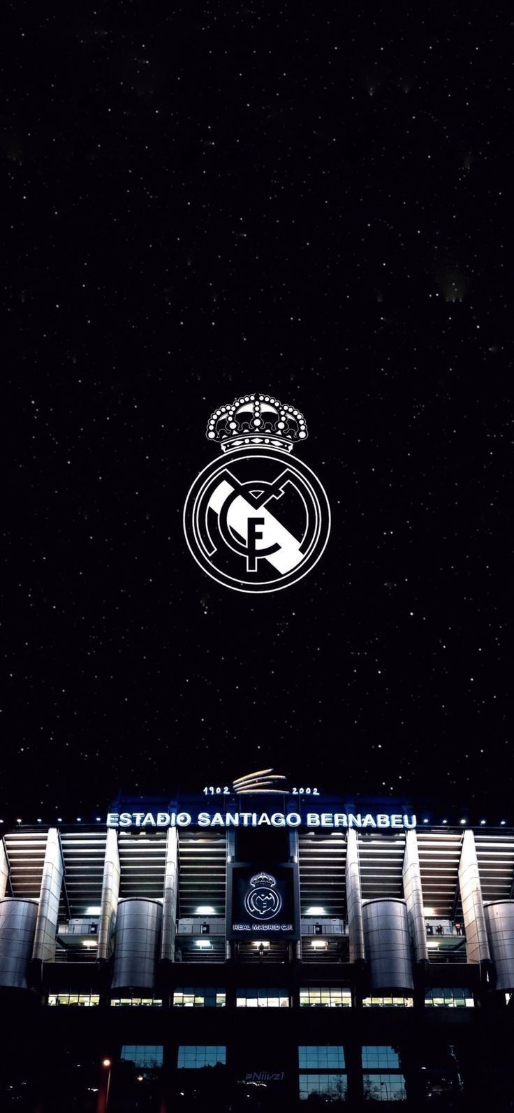 an image of a stadium at night with the words real madrid in front of it