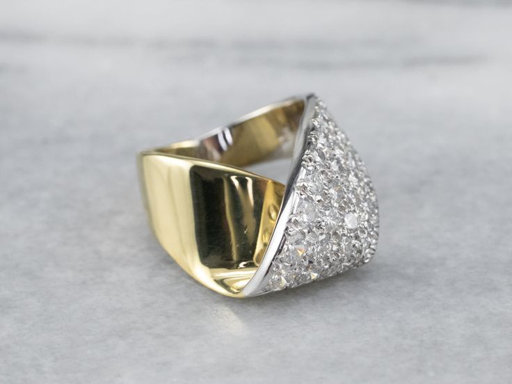 The simple wrap design of this ring is what saves it from being over the top, and keeps it the classy, sophisticated piece that it is. Rows of fine, bright, sparkling diamonds sit flush to the mounting, a perfect anniversary or cocktail piece!Metal: 18K Yellow and White GoldGem: 40 Diamonds totaling 2.15 Carats, SI1 in Clarity, H in ColorGem Measurements: 3.3 mm, RoundRing Size: 4.50Marks: "18K" Stamped on the inside band Modern Wide Band Ring With Brilliant Cut For Wedding, Modern Brilliant Cut Wide Band Wedding Ring, Modern Wide Band Ring With Tension Setting For Anniversary, Modern Wide Band Diamond Ring For Wedding, Anniversary Wide Band Ring With Tension Setting, Timeless Wide Band Diamond Wedding Ring, Diamond Wide Band Ring With Tension Setting For Wedding, Modern Wide Band Diamond Ring With Vvs Clarity, Wedding Wide Band Diamond Ring With Tension Setting