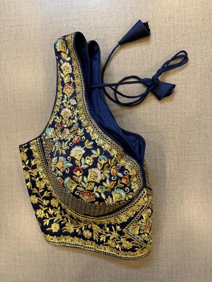 Exquisite blue heavy embroidery sleeveless saree blouse. Buy designer blouse in USA from Pure Elegance. Disclaimer: The actual product may vary slightly from the image. These are custom orders, hence expect slight variation in color, placement of the motif or buta. ESTIMATED DELIVERYBecause this is a custom order, it would take about 4 weeks from the date of purchase. RETURN POLICY: This product is a custom order and cannot be returned or exchanged.