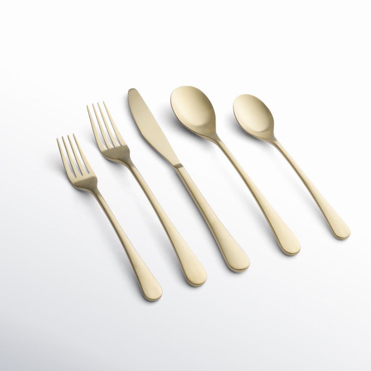 three forks, two spoons and one knife on a white surface with no background