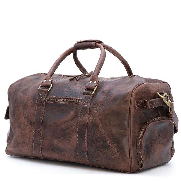 The Buffalo Leather Duffle Bag This classic men's buffalo leather duffel bag is the ultimate weekend escape companion. Whether it's a few days camping with the guys or a romantic weekend with a loved one, this buffalo leather weekender is designed to hold all the gear you need yet still show off your classic, rugged style. Perfect for the refined, timeless man, this buffalo leather duffel bag has all the functionality and durability you would expect from a bag that is designed to last a lifetime Rugged Large Capacity Duffle Bag For Travel, Rugged Brown Travel Bag With Large Capacity, Rugged Brown Duffle Bag With Large Capacity, Rugged Large Capacity Brown Travel Bag, Leather Weekender Bag With Large Capacity For Overnight Trips, Brown Leather Luggage For Overnight Trips, Large Capacity Leather Weekender Bag For Overnight Trips, Brown Waxed Travel Bag For Overnight Trips, Leather Travel Bag With Luggage Sleeve For Overnight Trips