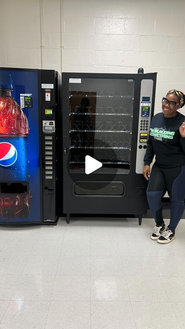 a woman standing next to a vending machine