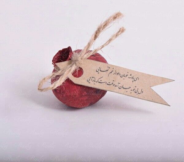 an apple with a tag attached to it