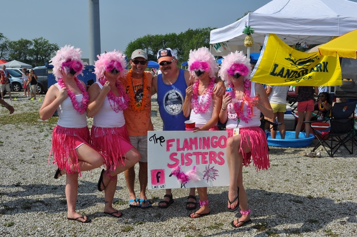 some people are posing for a photo at a festival