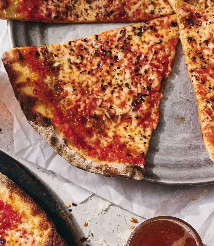 several slices of pizza sitting on top of a pan