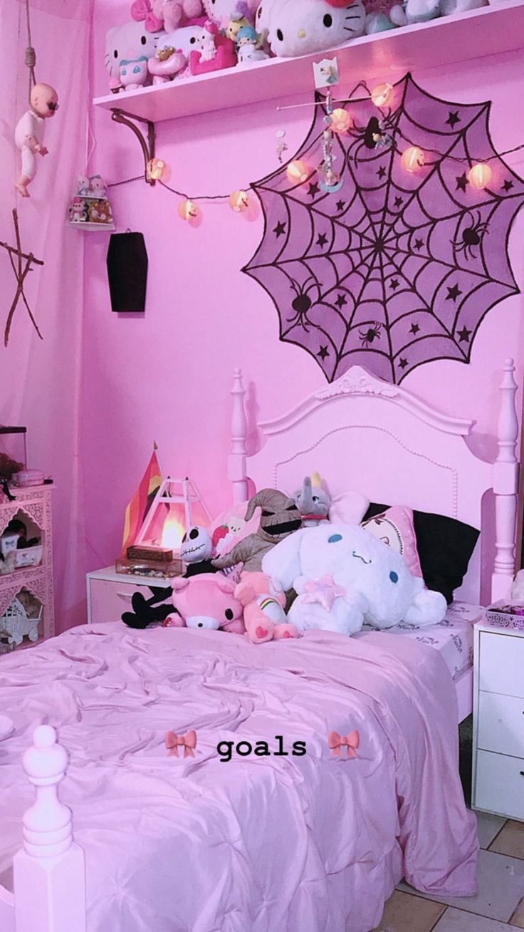 a bedroom with pink walls and lots of stuffed animals