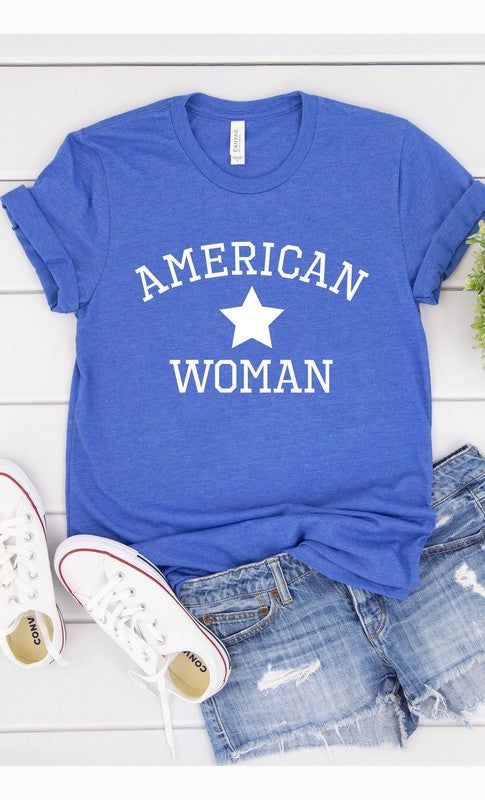 American Woman, USA, America, Independence Day, 4th of July, Patriotic Graphic Tee with white InkMade In: USAFabric Contents: Most t-shirt colors are 52/48 cotton/polyester blend. Athletic Heather & Black Heather are 90/10 cotton/polyester. White, cream, citron, pink, canvas red, lilac, mint are 100% cotton. Ash is 99/1. Comfortable Blue T-shirt With Graphic Print, Trendy Blue Soft-washed T-shirt, Trendy Soft-washed Blue T-shirt, Blue Slogan Shirt With Crew Neck, Blue T-shirt With Slogan In Relaxed Fit, Blue Crew Neck Shirt With Slogan, Basic Blue T-shirt With Slogan, Blue Screen Print Tops In Ring-spun Cotton, Comfortable Blue Letter Print Top