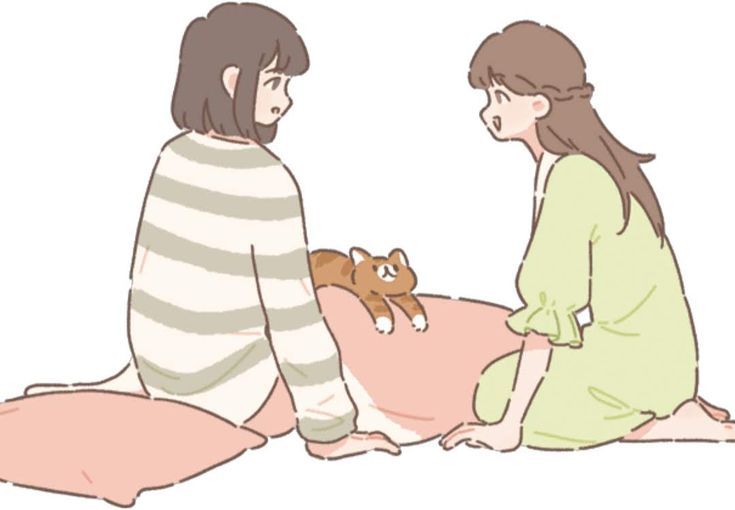 two women sitting on the floor talking to each other with a teddy bear in their lap