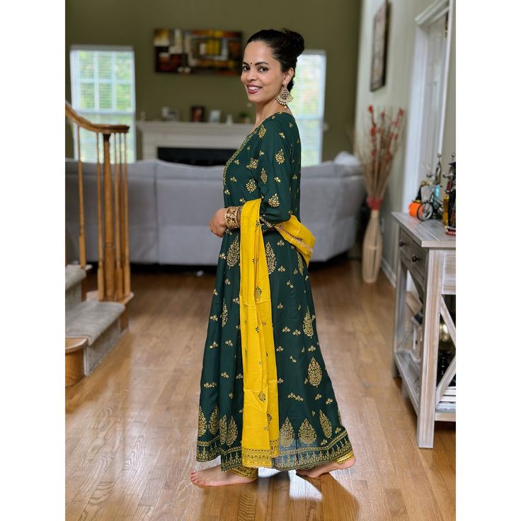 Classically elegant and indisputably festive, this Dark Green and Yellow Kurta Set is perfect for adding a touch of flowing glamour to your wardrobe. Each piece of the set is crafted with soft, comfortable fabric and features vivid dark green and sunny yellow tones, creating an eye-catching look that can accent any ensemble. Complete your look with this set for a timeless chic look that will make any event extra special! Note : This is a 3 piece set and includes the Kurta, pants and Dupatta Note A Line Anarkali, Kurta Pants, Yellow Kurta, Timeless Chic, Sunny Yellow, Yellow Tones, Kurta Set, Green And Yellow, Anarkali