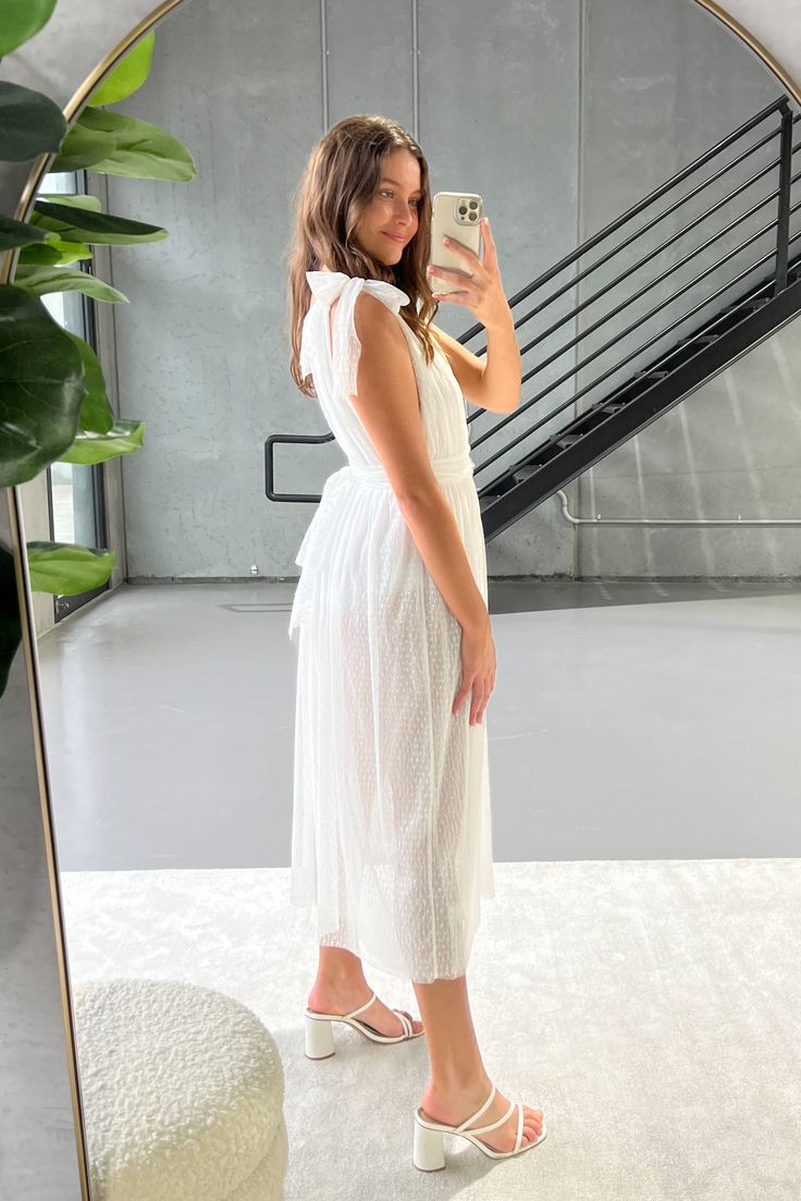 Our favourite statement piece from the HER Empire The Label collection. As seen on @maya_gypsy and @paris.jacobson. This stunning pleated mesh midi dress features a grecian feel with a plunging V cut neckline, tie up adjustable bow straps at the shoulders, attached briefs (like a bodysuit) and a multi-layer mesh flowing skirt. Also includes detachable mesh waist sash (see extra images) A truly one of kind timeless piece perfect for special occasions and festivals. Our model wears size XS. This s