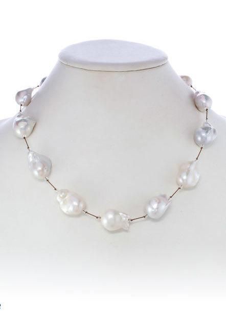 Large White Baroque Pearl Necklace Luxury Silver Pearl Necklace With Polished Beads, High-end White Bohemian Beaded Necklace, Luxury White Baroque Pearl Necklace, Luxury White Baroque Pearl Jewelry, Luxury White Baroque Pearl Necklaces, White Baroque Pearl Jewelry, Pear-shaped Single Strand Baroque Pearl Jewelry, Elegant White Baroque Necklace, White Baroque Pearl Single Strand Necklace