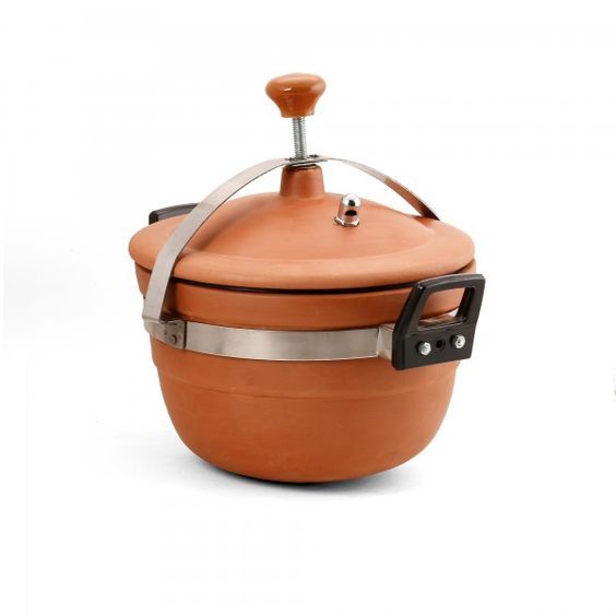 an orange pot with a lid and handle on it, sitting in front of a white background