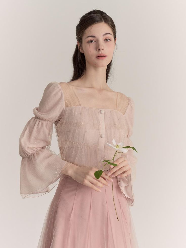 The blouse that has subtle sparkled surface. Featuring the voluminous frill detail, shirring, and smocking detail at shoulder, and squared neckline gives elegant mood. Style with skirts or trousers to create elegant looks. - Squared-neckline and long-sleeved design- Button closure detail at front- Layered frill detail throughout- Relaxed silhouette and standard length- Shirring and smocking detail at shoulder- Pearl and sparkle surface Mood Style, Squared Neckline, Square Necklines, Pink Beige, Pink Blouse, No Frills, Smocking, Top Blouse, Sparkle