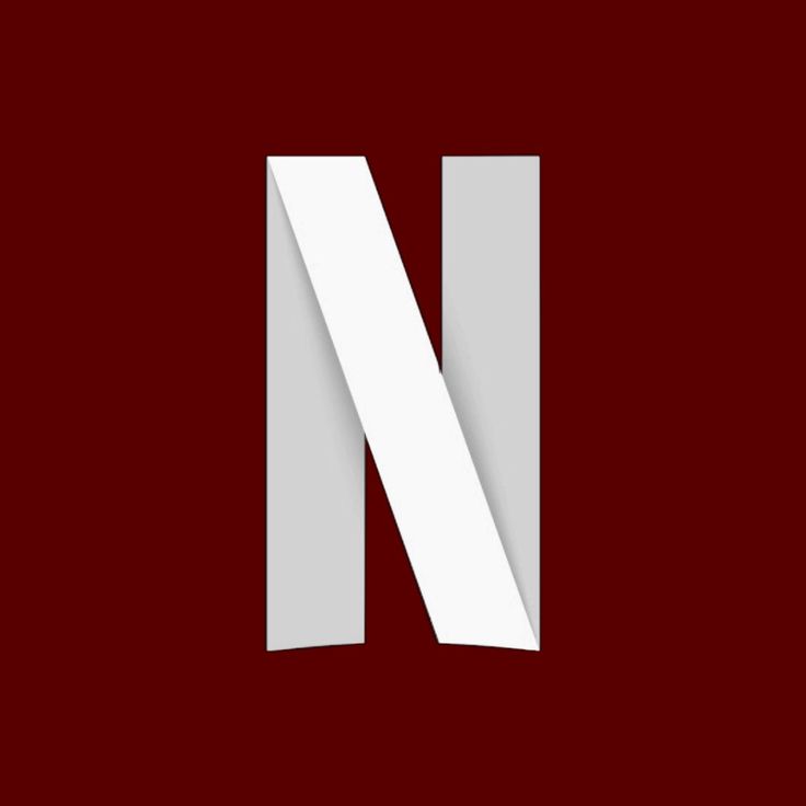 the letter n is cut in half and placed on top of a red background with white paper