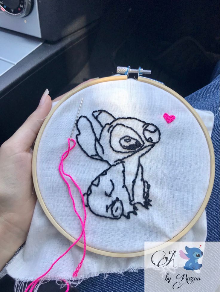 someone is holding a small embroidery project in their hand and it looks like an elephant