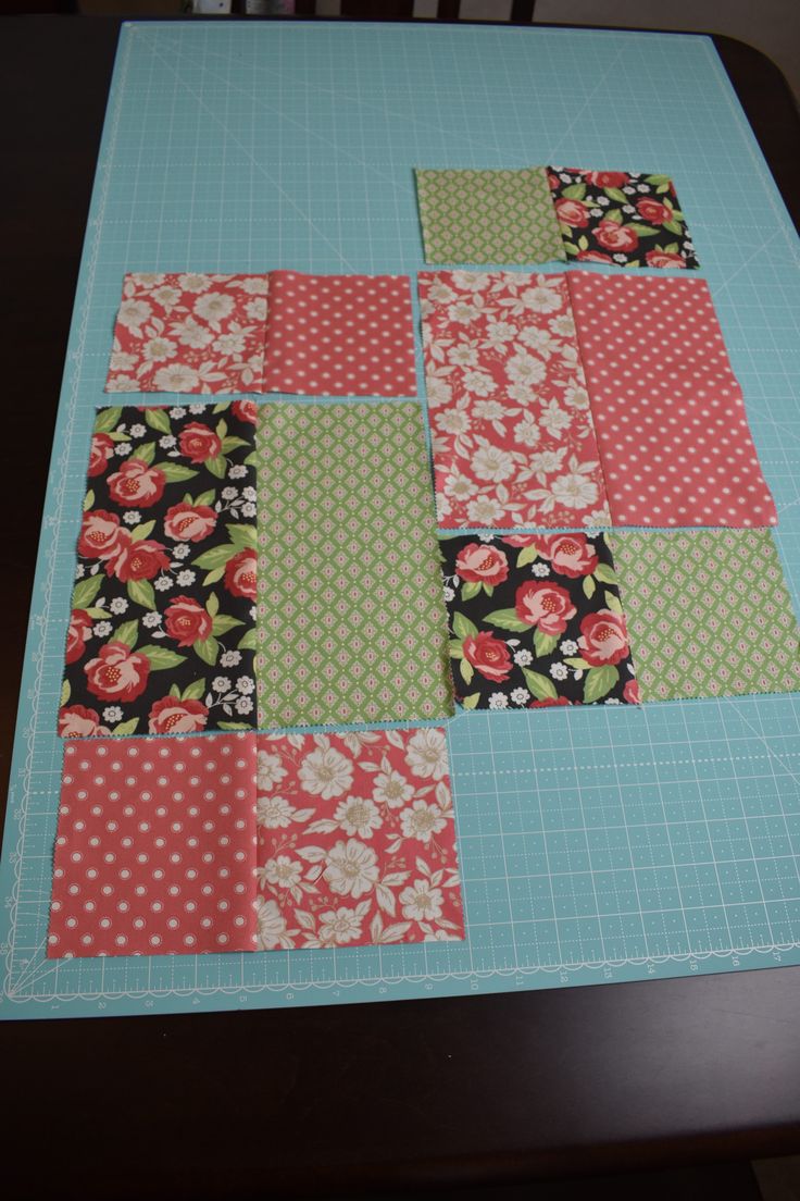 a piece of fabric is laying on top of a cutting board with flowers and polka dots