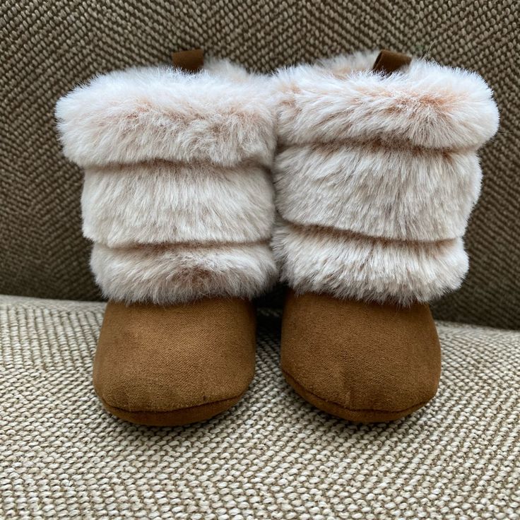 Cute Little Winter Booties To Keep Your Little Warm And Stylish! Super Soft Faux Fur And Faux Suede Boot Are Perfect For Cold Weather Outings. Easy On And Off With Velcro Closure For Snug Fit. Size 3-6 Months. Never Worn. Brown Winter Boots With Soft Sole, Winter Beige Closed Toe Booties, Beige Closed Toe Winter Booties, Cream Round Toe Winter Booties, Winter Booties With Soft Sole And Closed Toe, Cute Brown Round Toe Slippers, Comfortable Soft Booties With Round Toe, Comfortable Soft Round Toe Booties, Cute Soft Booties With Round Toe