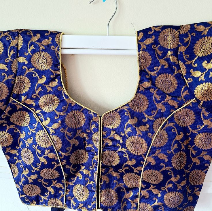 Beautiful Brocade Saree Blouse In Size 38 And Has Additional Cloth Margin To Expand The Seams To 40.Will Fit A U.S Size 4 To 6. 1 Piece Available Blue Bollywood Choli With Long Sleeves, Blue Bollywood Long Sleeve Choli, Blue Long Sleeve Bollywood Choli, Blue Long Sleeve Choli With Zari Work, Blue Long Sleeve Choli For Festive Occasions, Elegant Blue Tops With Self Design, Festive Blue Long Sleeve Choli, Festive Long Sleeve Blue Choli, Royal Blue Unstitched Blouse Piece For Festive Occasions