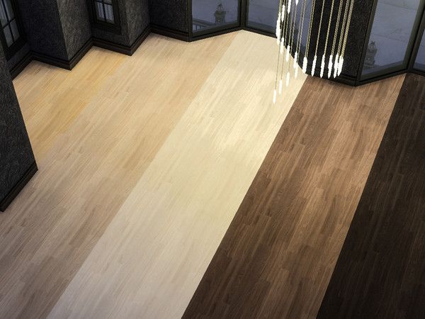 an empty room with wooden floors and glass doors on the wall, looking down at it