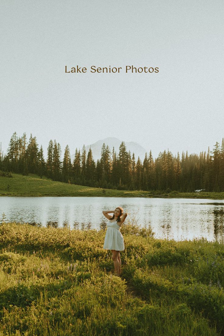 a woman standing in front of a lake with the words lake senior photos above her