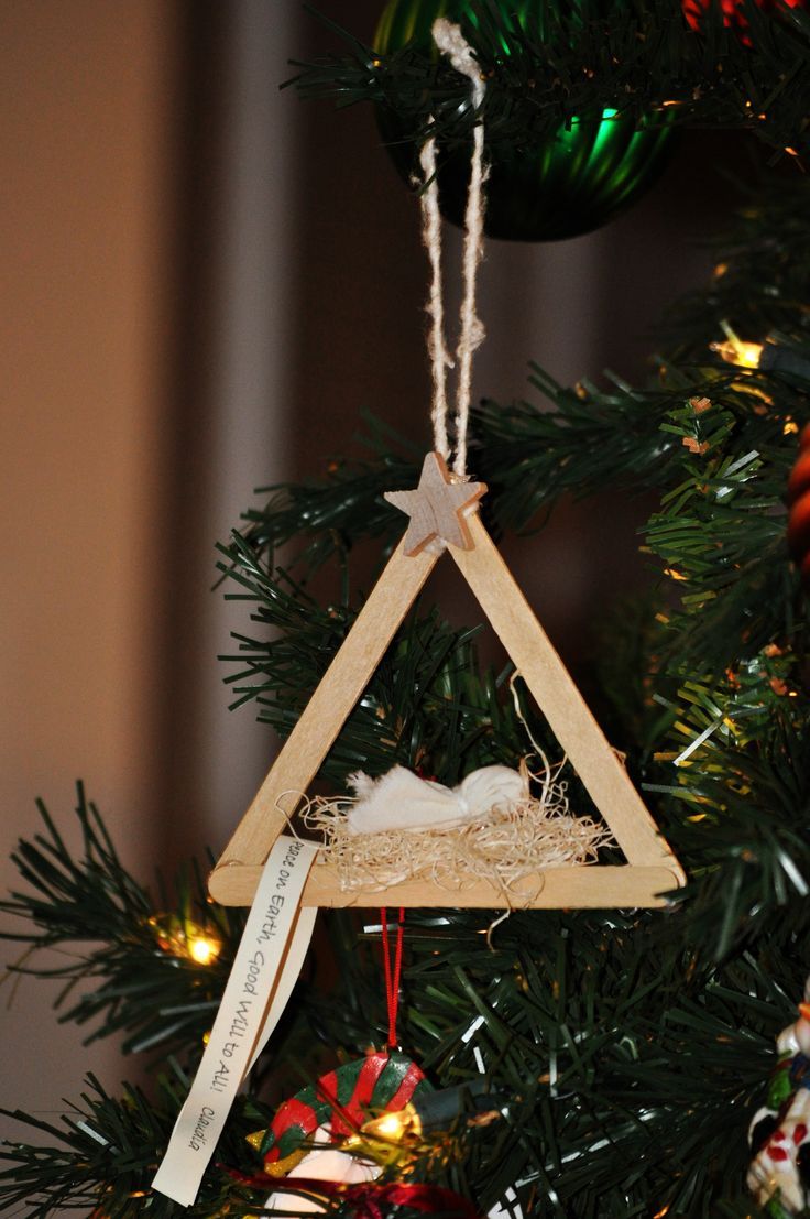 a christmas ornament hanging from a tree