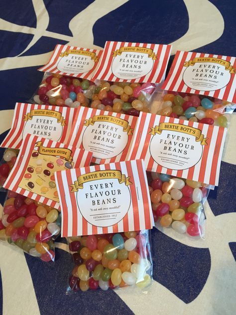 candy bags filled with jelly beans sitting on top of a table