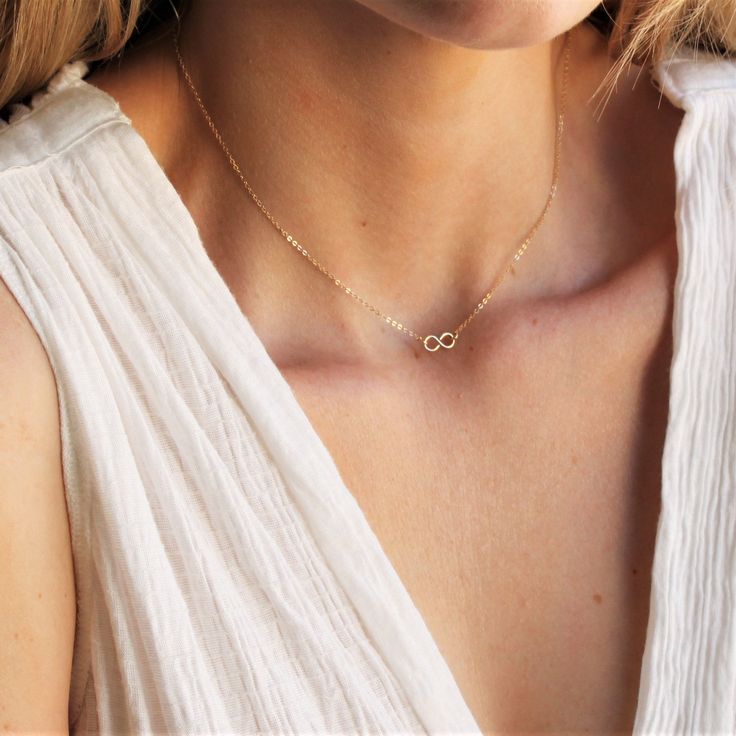 This gold infinity necklace is the perfect daily reminder that some things are for infinity! A wonderful addition to your minimalist jewelry collection or as a meaningful gift! •100% 14kt Gold Water friendly Model is wearing 16 inch in photos. Minimalist Infinity Clavicle Chain Necklace, Everyday Delicate Infinity Chain Necklace, Minimalist Infinity Necklace With Delicate Chain, Minimalist Gold Infinity Necklace, Minimalist Infinity Gold Necklace, Dainty Infinity Necklace As Gift For Her, Dainty Infinity Necklace With Delicate Chain, Minimalist Infinity Necklace For Everyday, Personalized Minimalist Infinity Necklace