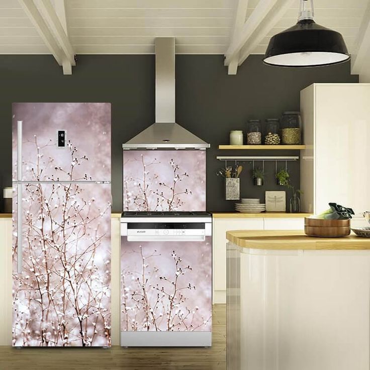 the refrigerator is decorated with pink flowers on it's side and has an oven