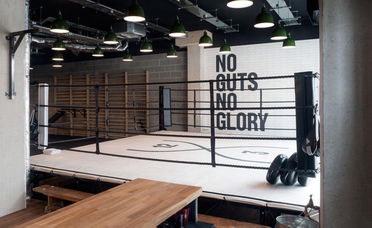 the inside of a boxing ring with no guts, no glory written on the wall