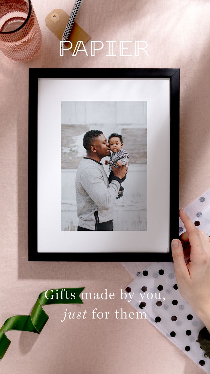 a woman holding a baby in her arms with the words papier gifts made by you just for them