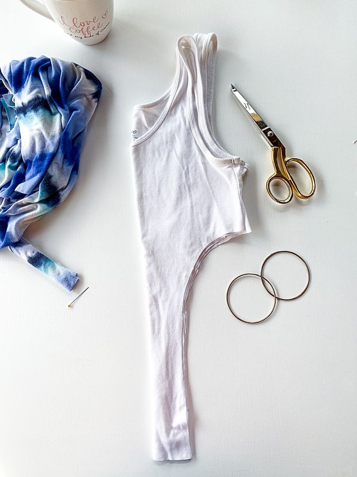 a pair of scissors and some hair accessories on a table