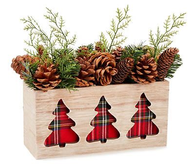 a wooden box filled with pine cones and christmas trees