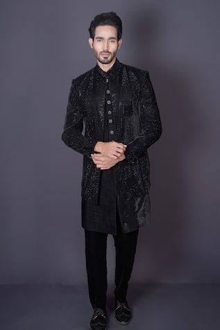 Bold black jacket featuring intricate hand embroidery done with stones, cutdana and sequins. Comes with a sleeveless sherwani and pant. - Aza Fashions Traditional Long Sleeve Sequined Bandhgala, Designer Black Nehru Jacket With Traditional Drape, Designer Long Sleeve Nehru Jacket With Mirror Work, Designer Black Sets For Winter, Black Long Sleeve Designer Bandhgala, Fitted Long Sleeve Nehru Jacket With Mirror Work, Designer Wear Bandhgala With Sequins And Traditional Drape, Embellished Long Sleeve Nehru Jacket For Designer Wear, Traditional Black Sherwani With Sequins