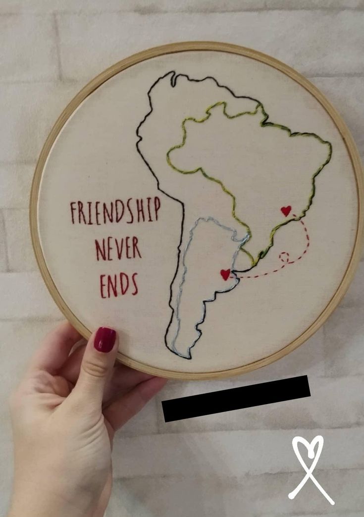 someone is holding up a cross - stitch hoop with the words, friendship never ends