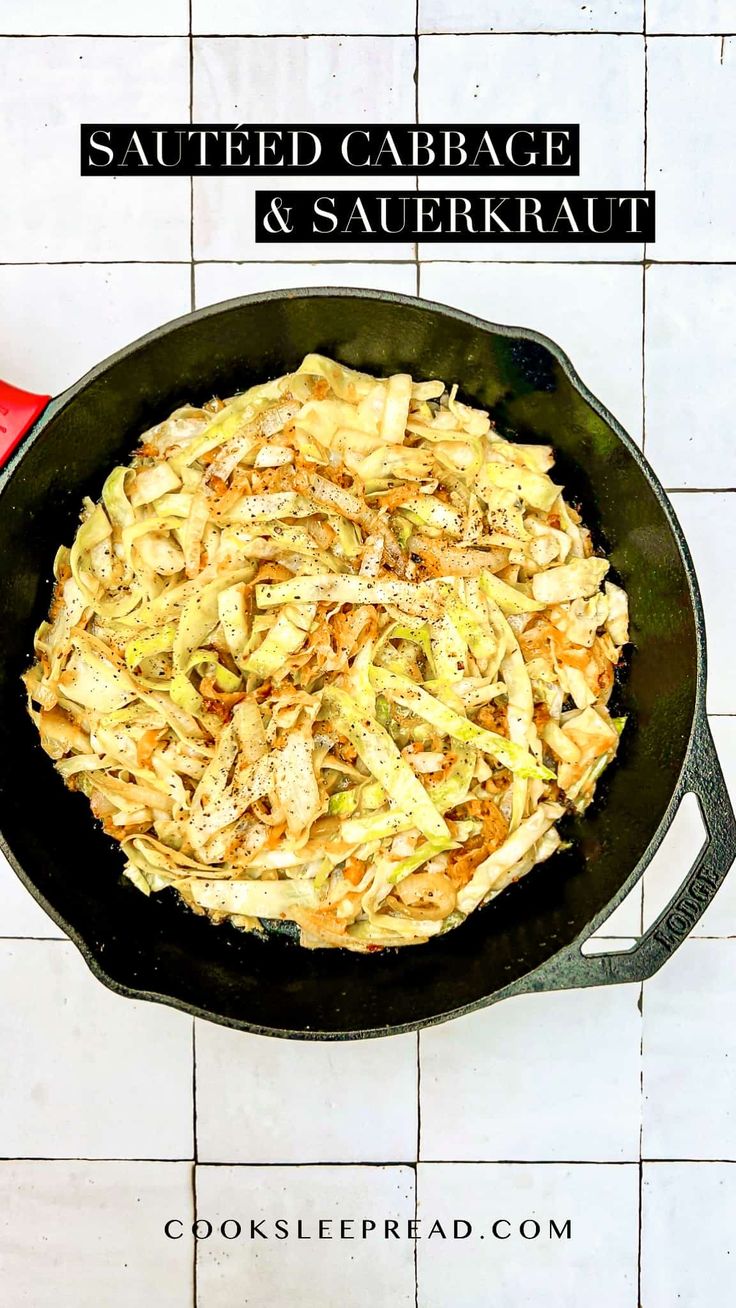 sauteed cabbage and sauerkraut in a cast iron skillet on a white tile floor