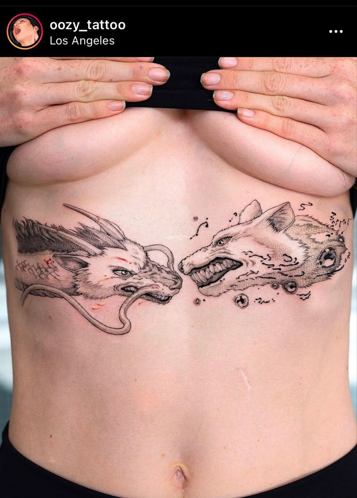 a woman's stomach with two dragon tattoos on her back and the other side