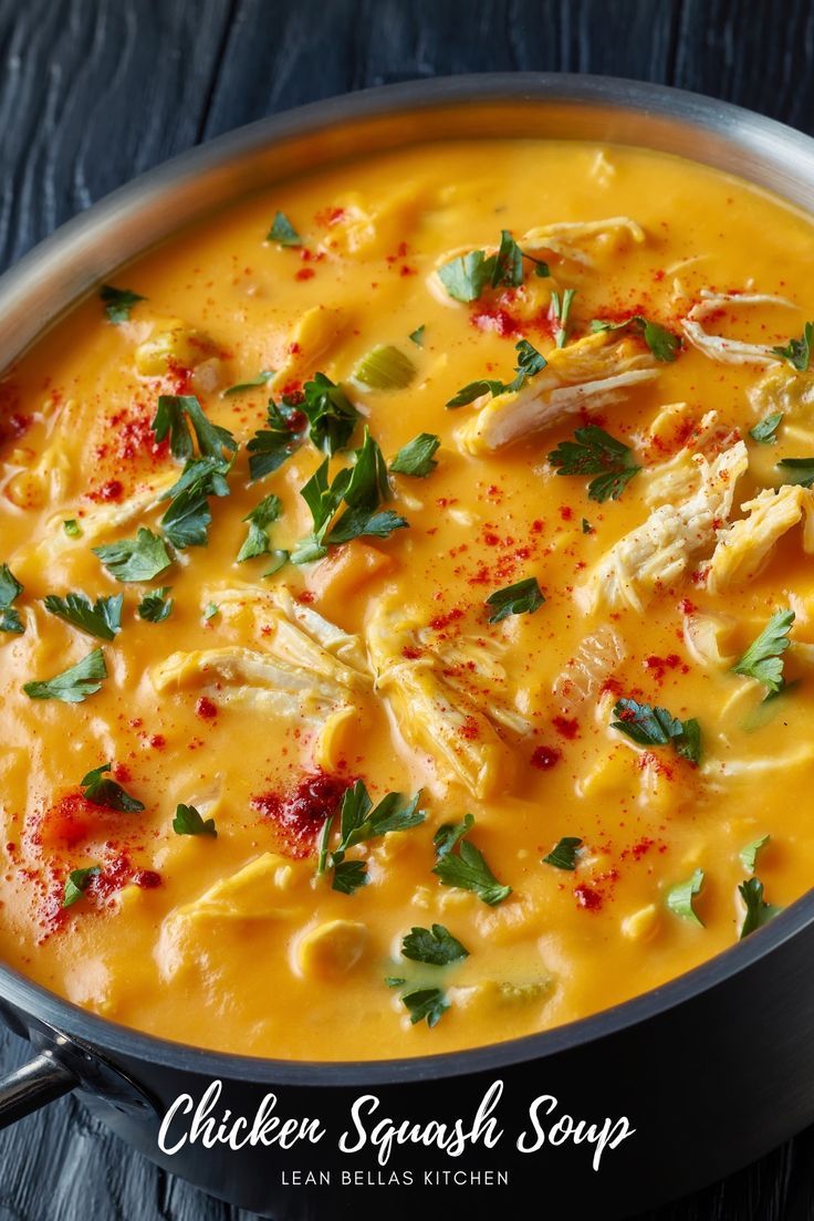 chicken and squash soup in a pan with parsley on the top, ready to be eaten