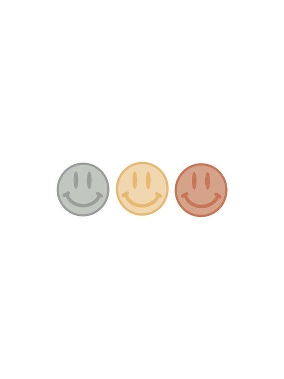 three smiley faces in different colors