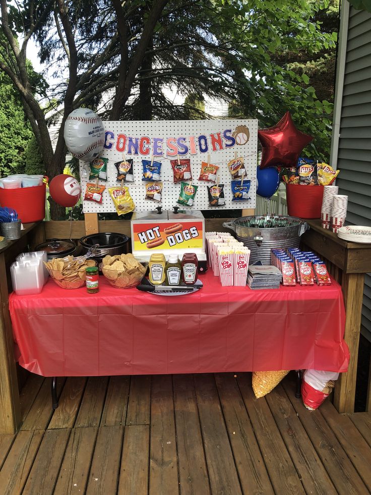 a red table topped with lots of food next to a sign that says jones on it