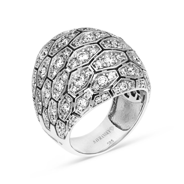 Make a fashion statement with our Diamond Pave Dome Cocktail Ring. Hand made with 18K white gold, this ring features a cluster of elongated hexagons paved with three small round brilliant cut diamonds crafted in a dome shape. The perfect gift for a woman who enjoys standing out in a crowed with unique designer jewelry pieces. Available in all sizes, send us yours! 2.67 carat cocktail ring 14K white gold The ring design can be customized to suit your particular taste & budget with any Size, C Cocktail Ring Designs, Crossover Diamond Ring, Bling Ideas, Rose Gold Diamond Ring, Ring Hand, Unique Jewelry Designs, Blue Sapphire Rings, Love Ring, Blue Rings