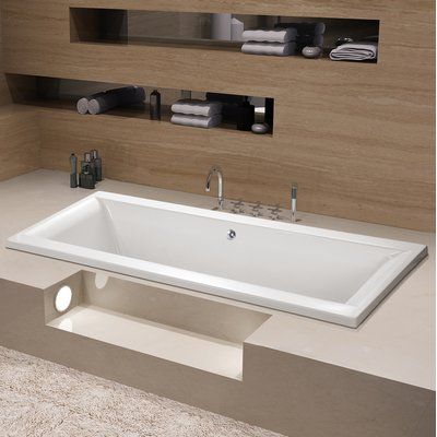 a white bath tub sitting on top of a counter