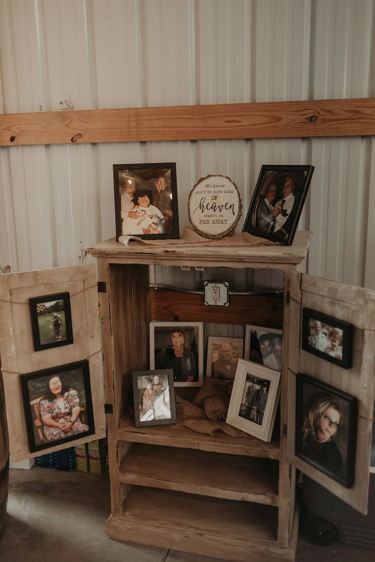 an old wooden cabinet with pictures on it