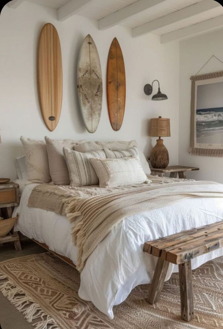 a bedroom with three surfboards mounted to the wall